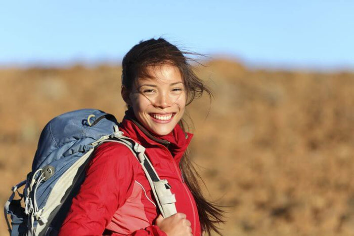 woman smiling on a hike